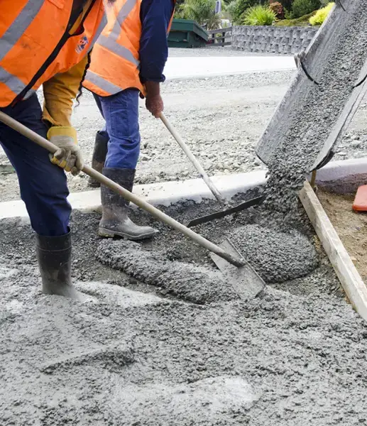 Crew leveling a fresh concrete pour
